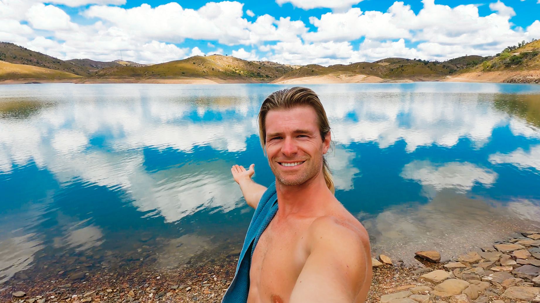 Lukas posing by a lake 