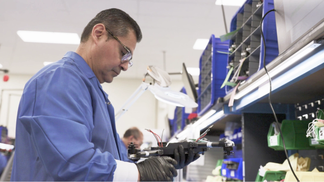 Skydio manufacturing employee assembing drone