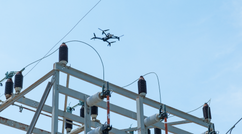 drone flying around utility pilons