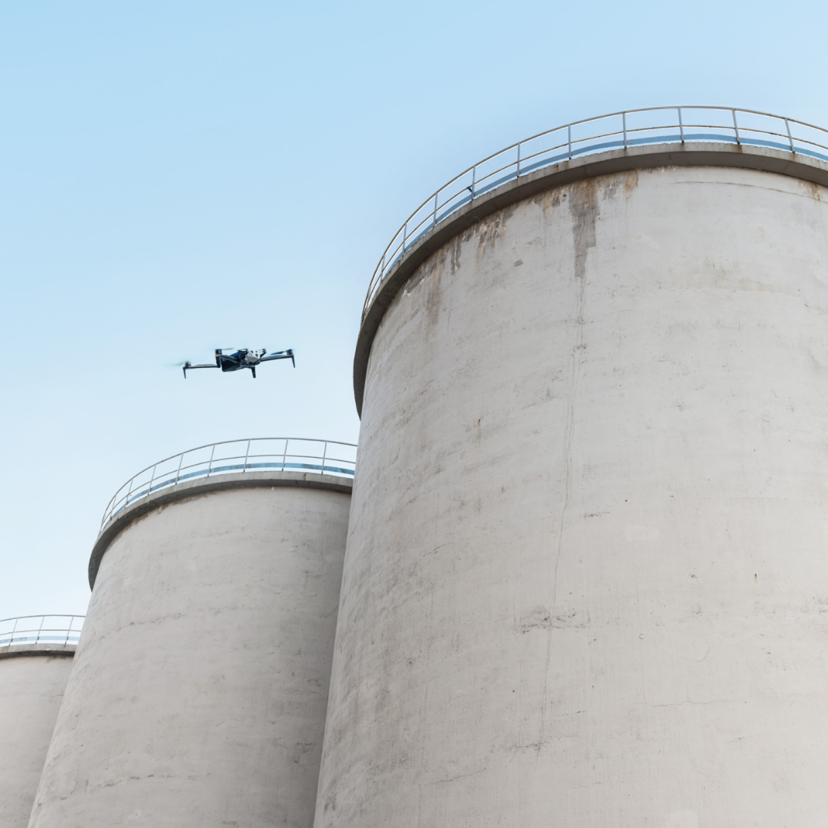 Skydio X10 drone flying above and inspecting a boiler