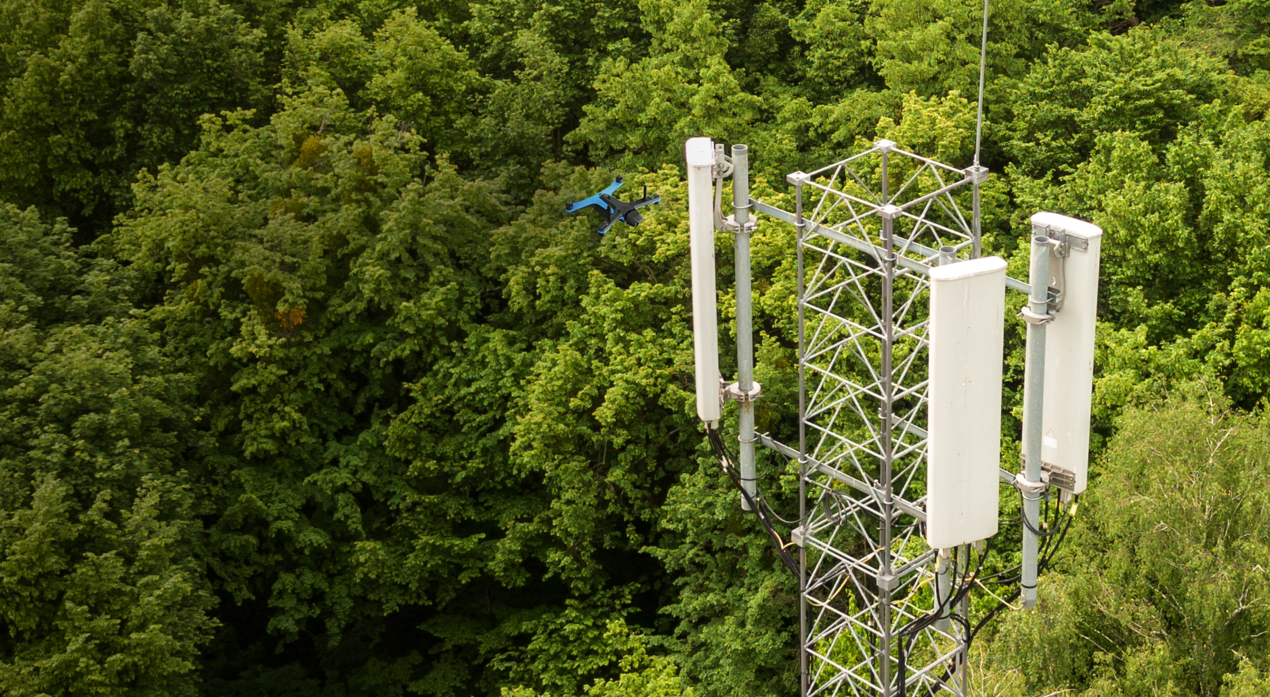 View of Skydio drone in flight inspecting cell tower