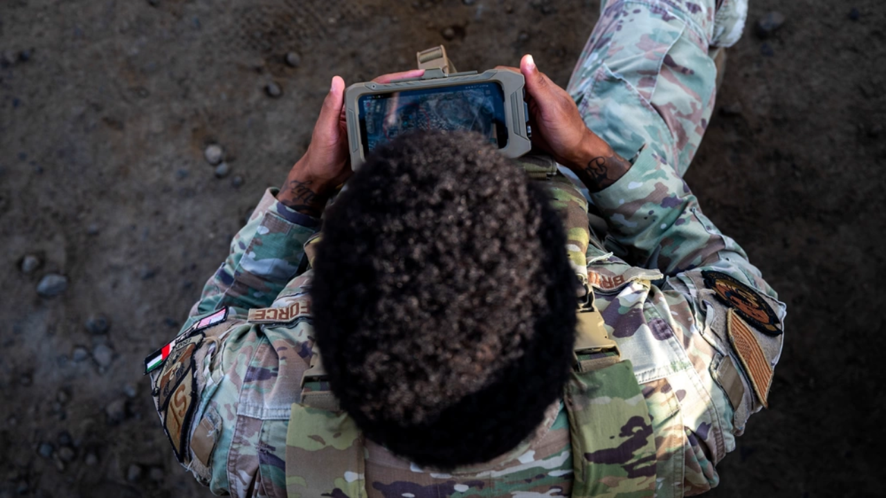 Airman holding an ATAK controller