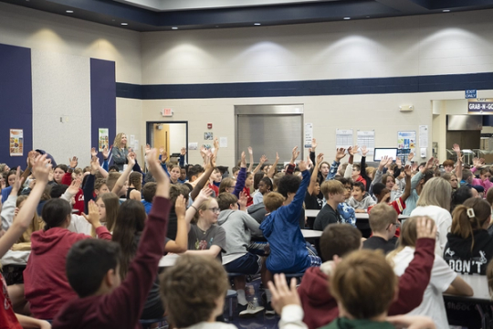 kids raising hands