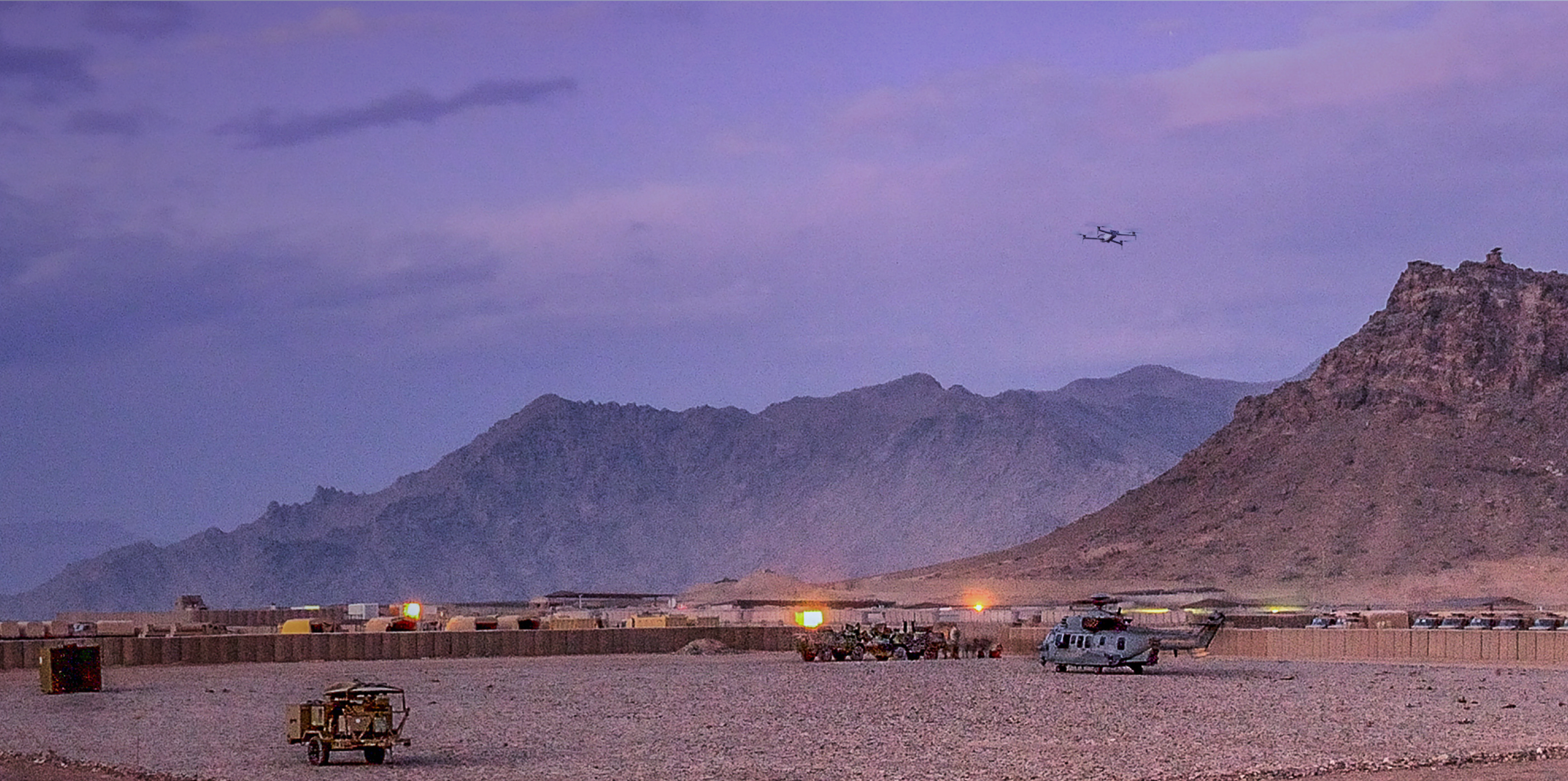 Skydio X10D monitoring a military base at dusk landscape view