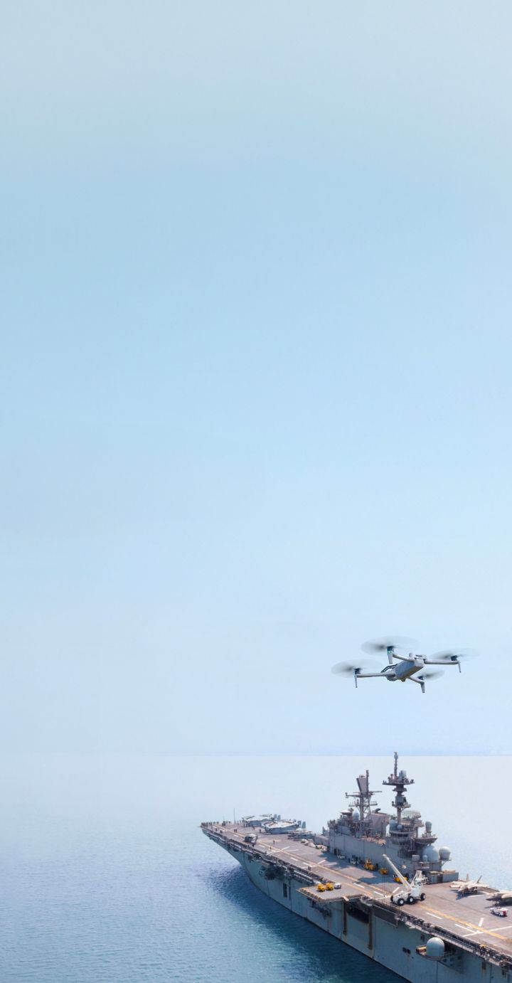 Skydio X10D inspecting aircraft carrier portrait view