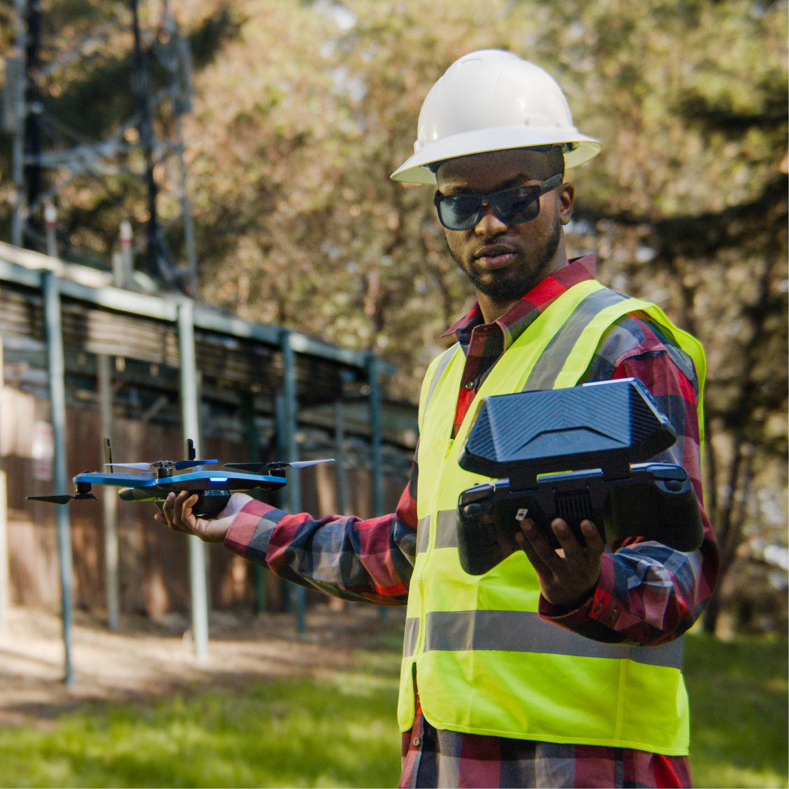 Construction drone pilot launching drone using a Skydio controller