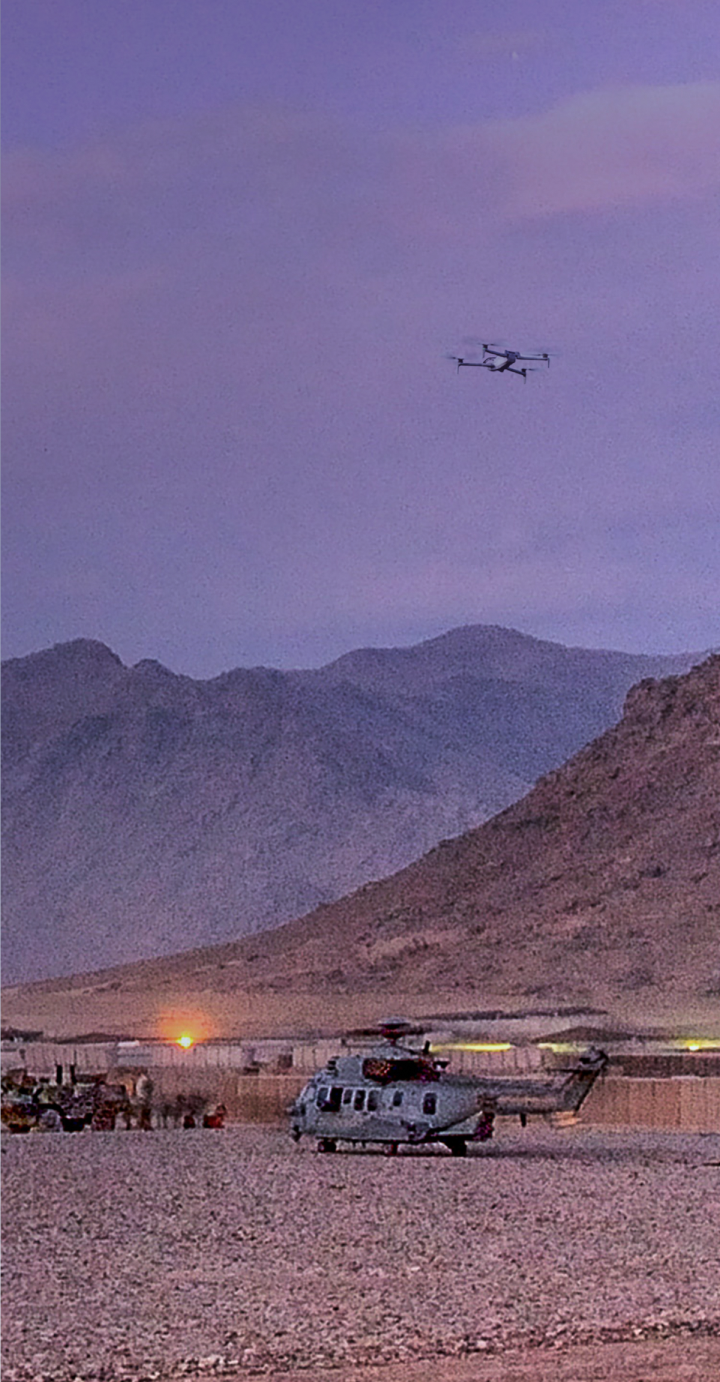 Skydio X10D monitoring a military base at dusk portrait view