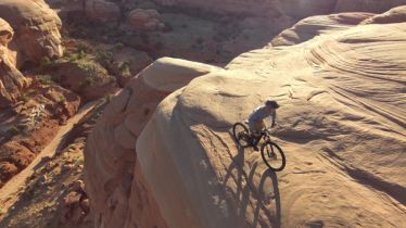 Autonomous Drone aerial photo of mountain biking