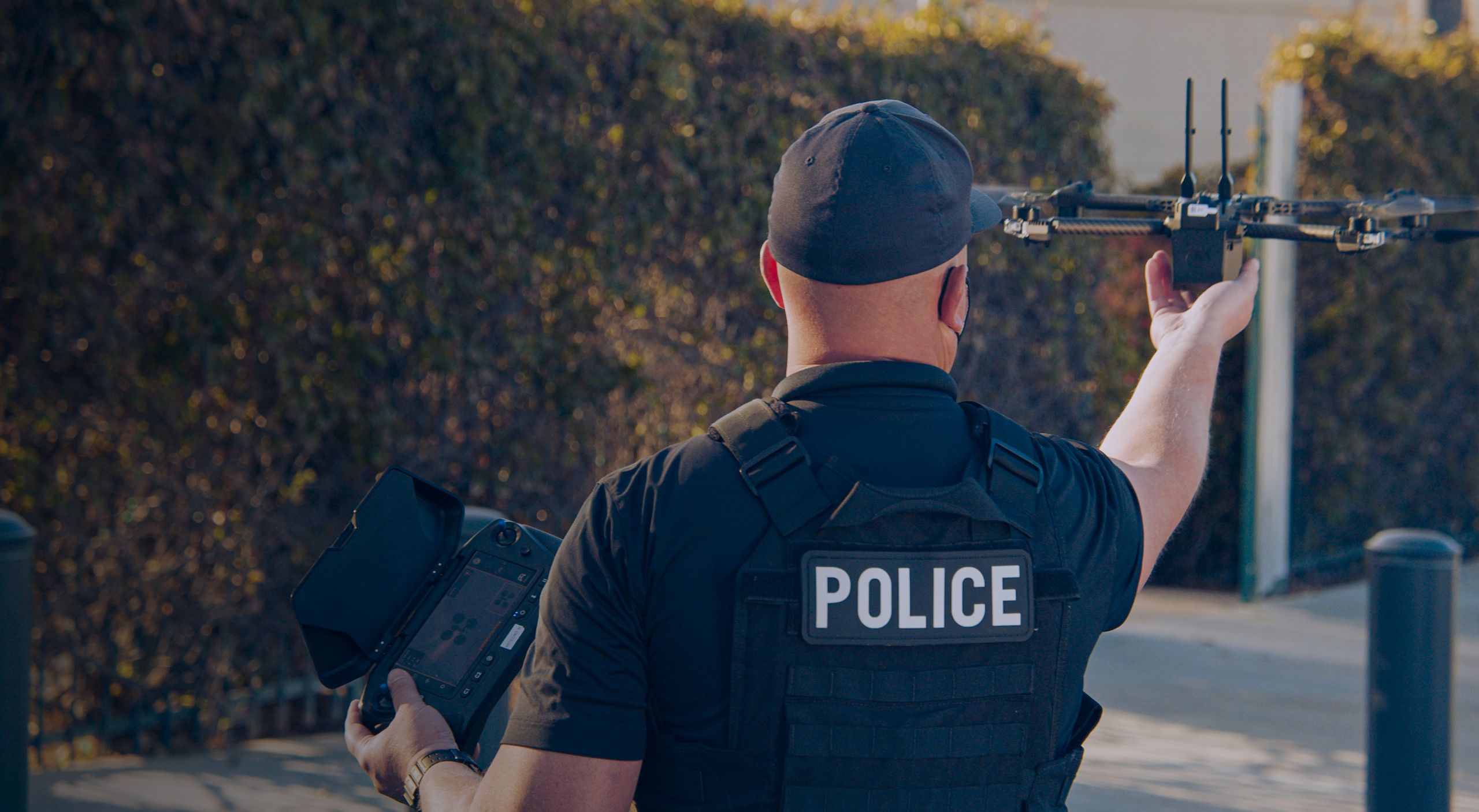 police holding skydio drone for takeoff