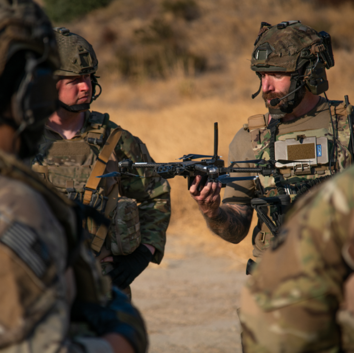 Soldier holding and letting go of a Skydio ISR drone