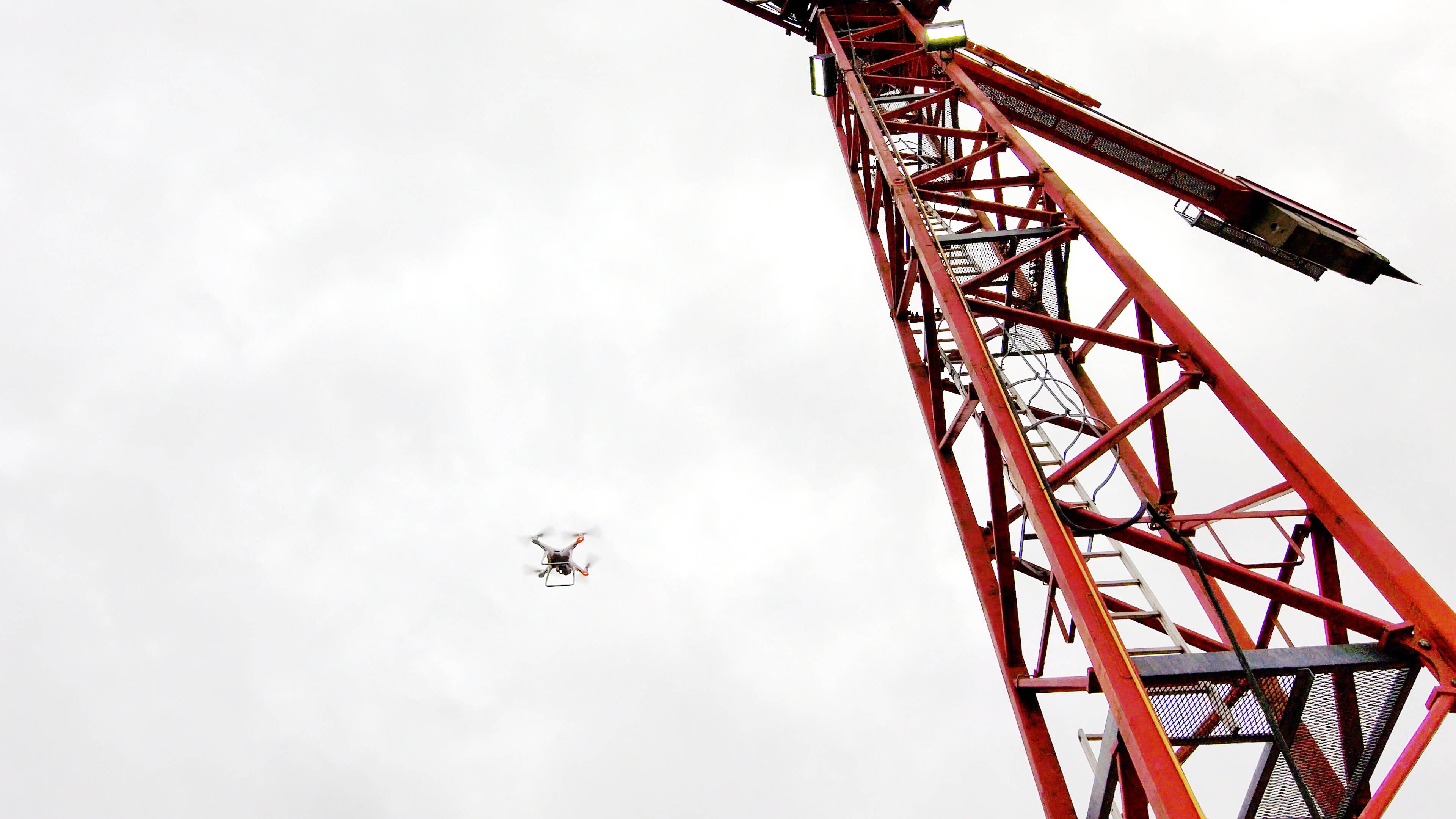 Manual drone inspecting a large tower