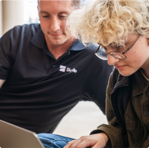 Skydio employee helping customer with application on laptop