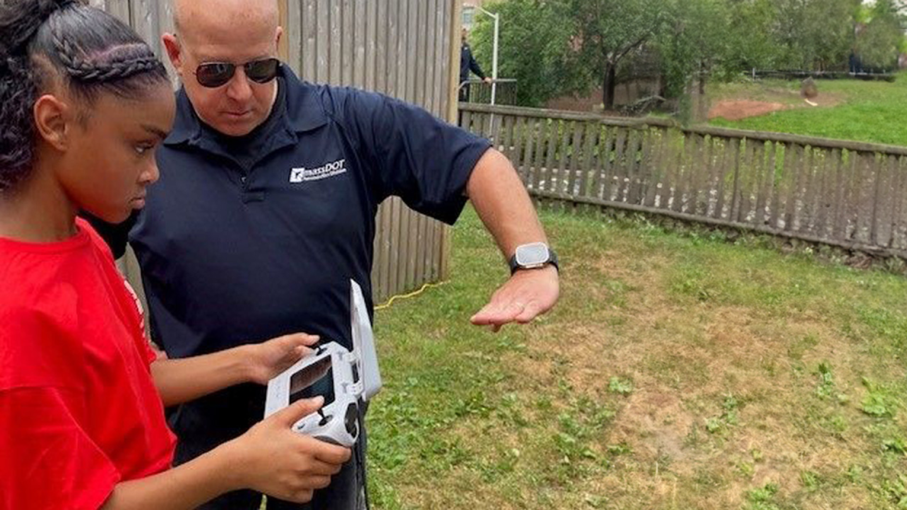 child learning to fly a drone