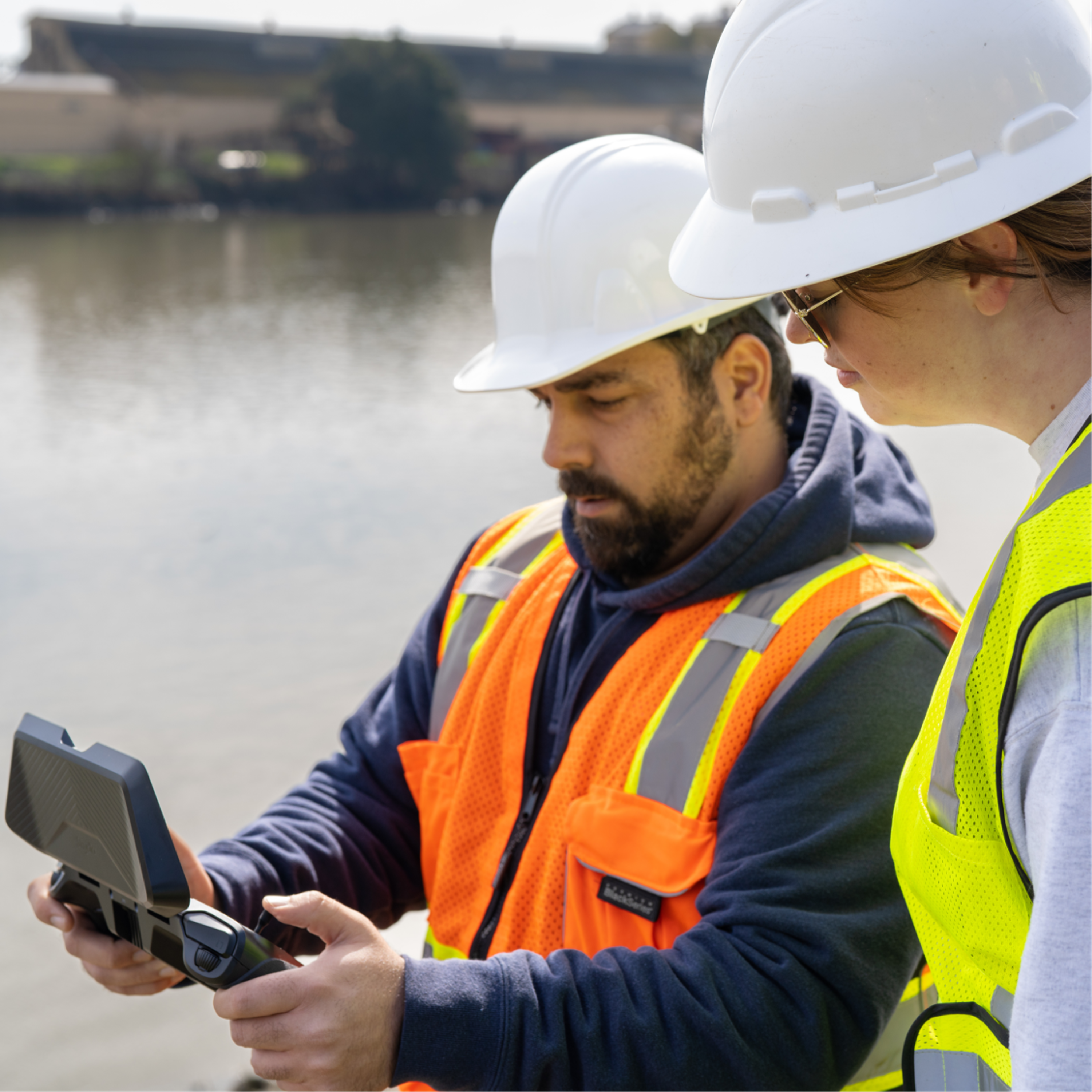 Workers holding a Skydio drone controller