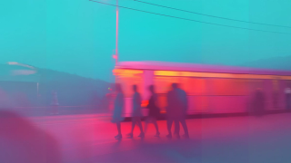 Abstract scene with blurred figures and a neon-lit tram, creating a dynamic, colorful motion effect against a teal sky.