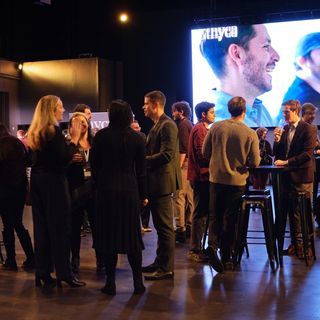A lanyard card with "Ethyca" written on it being worn by an event attendee.