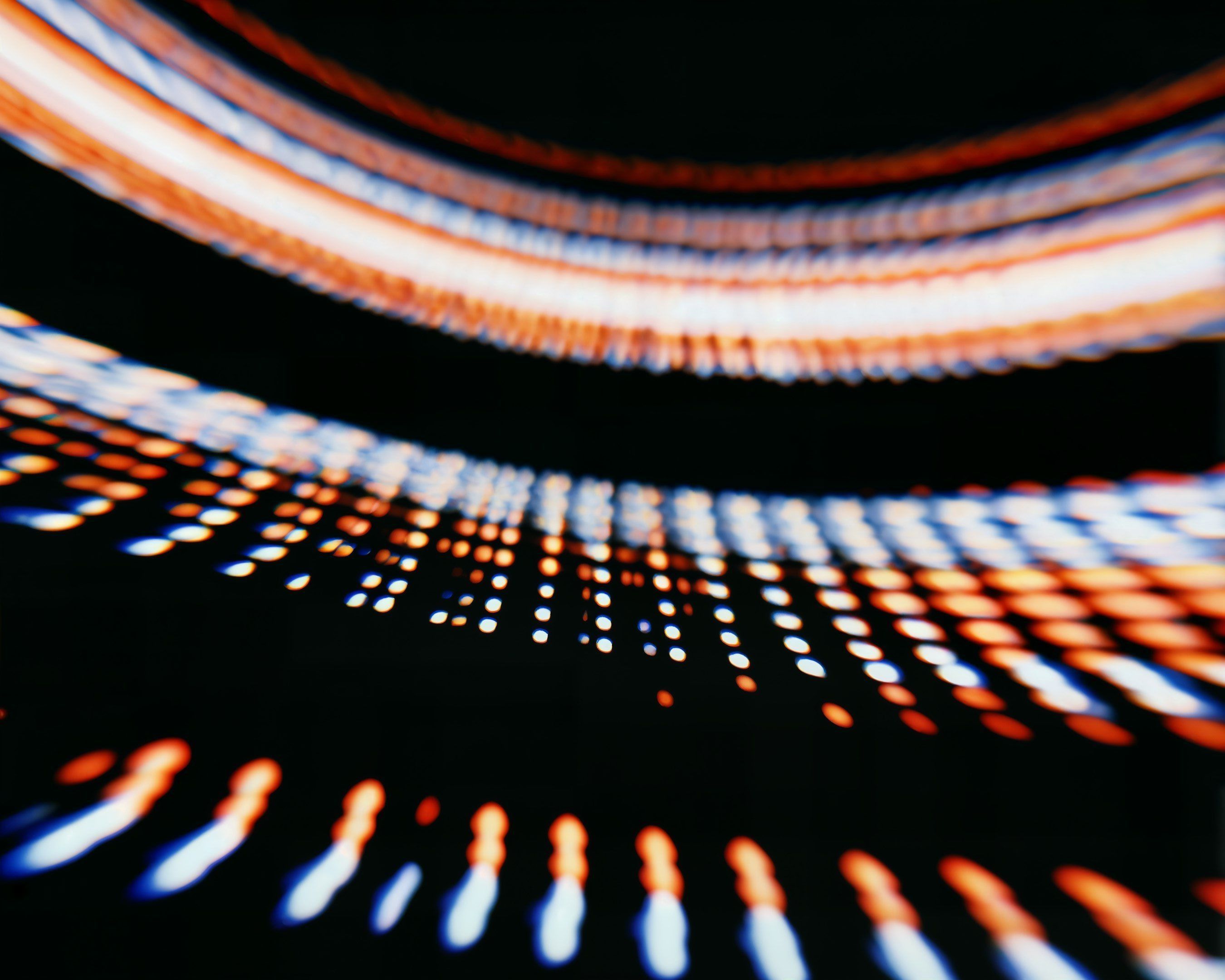 Abstract light trails in orange and blue tones