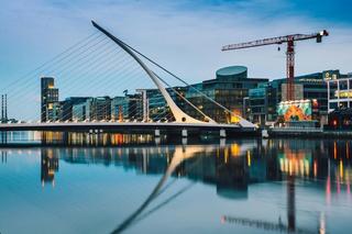 Skyline of Dublin with a bridge, buildings and a crane.
