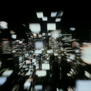 Abstract cityscape at night with zoom blur effect