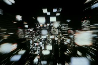 Abstract cityscape at night with zoom blur effect