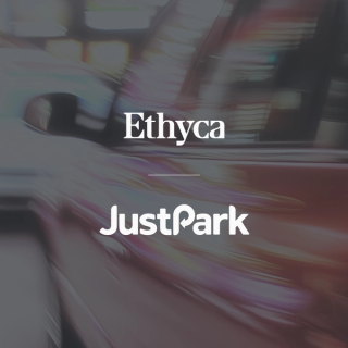 justpark and ethyca logos over abstract light trails in motion