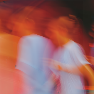 Abstract motion blur with vibrant orange, red, and blue tones