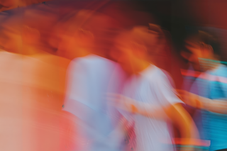 Abstract motion blur with vibrant orange, red, and blue tones