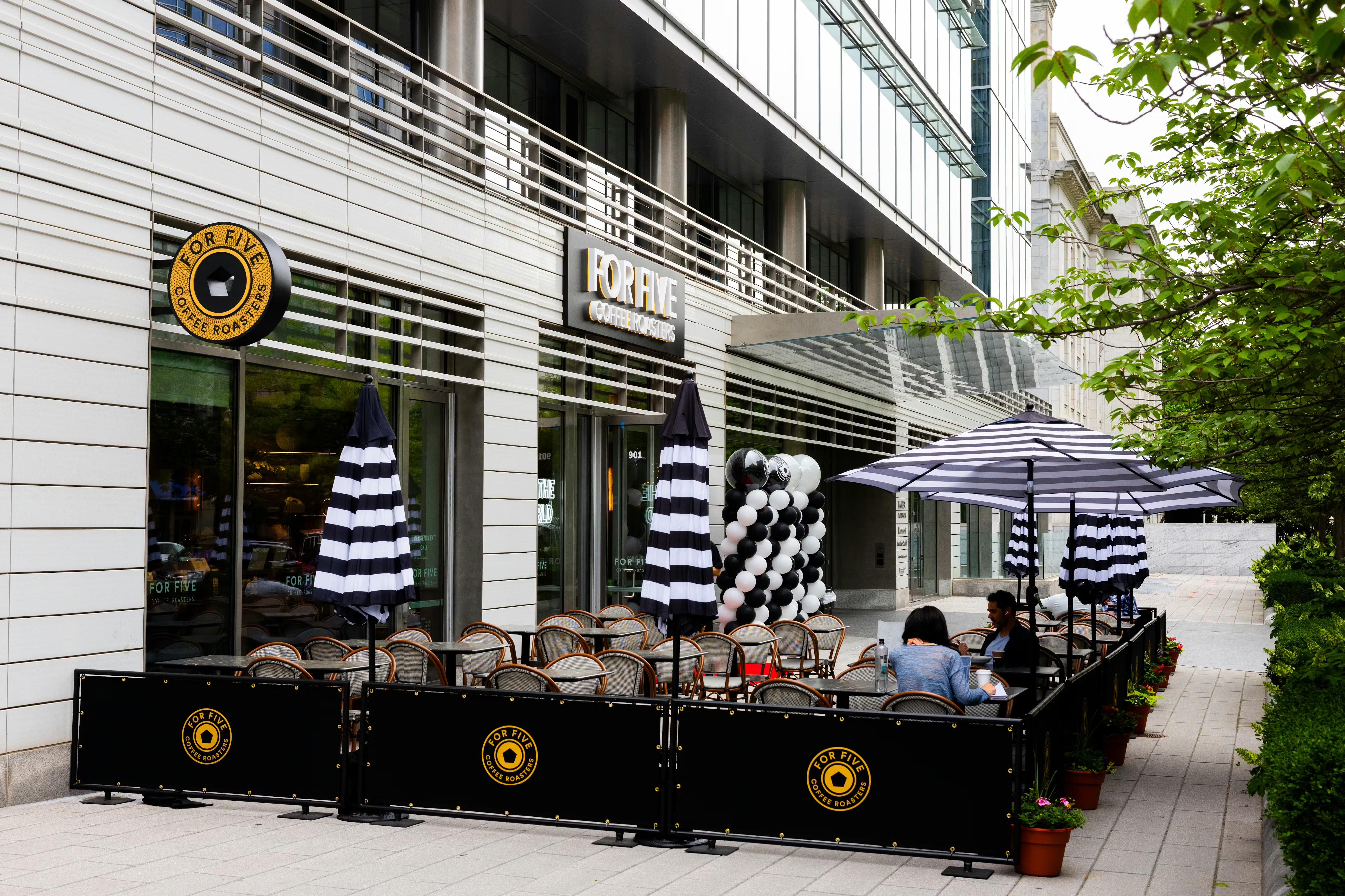 Espresso being poured through a machine, close up photograph.