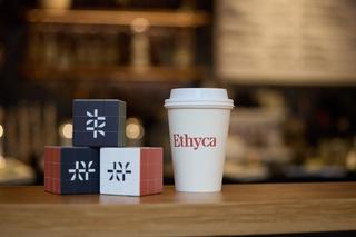 Rubiks cubes with Ethyca logo and Ethyca branded cup.