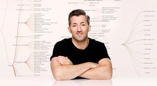 Founder & CEO of Ethyca, Cillian Kieran, in front of the Ethyca logo and data taxonomy.