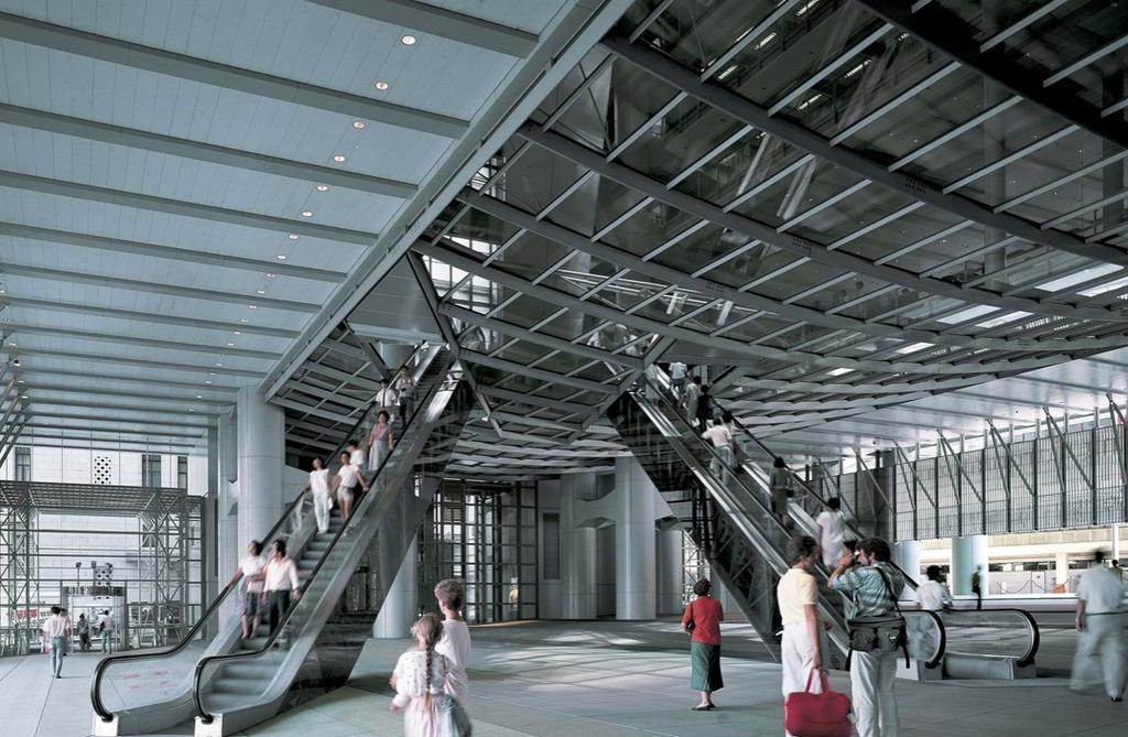 The open plaza beneath the HSBC building with escalators and people