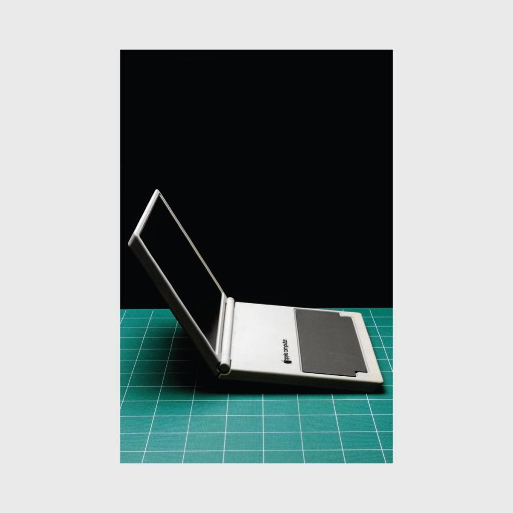 An open Apple Computer tablet concept on a green cutting mat