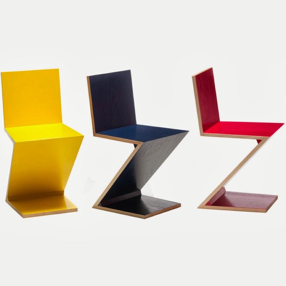 Three Rietveld Zig-Zag chairs in yellow, dark blue and red