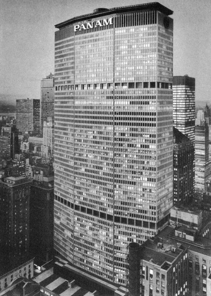 The Pan Am Building skyscraper in New York bearing the inscription PAN AM, a black-and-white shot amid the city