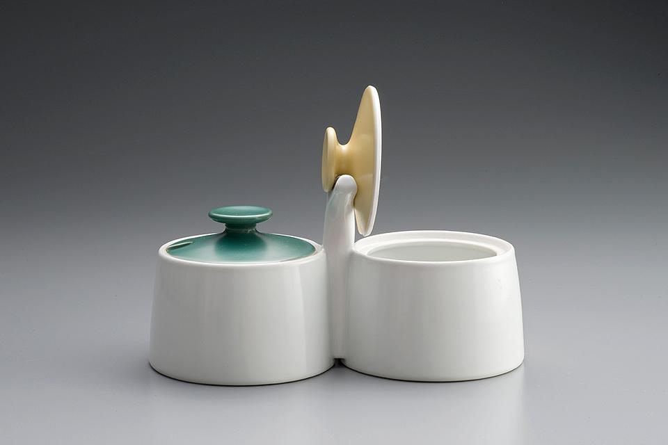 Double porcelain condiment container with green and yellow lids