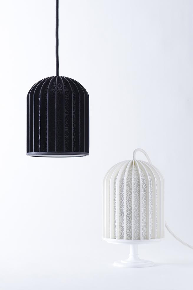 Black and white birdcage-shaped lamps with an openwork pattern