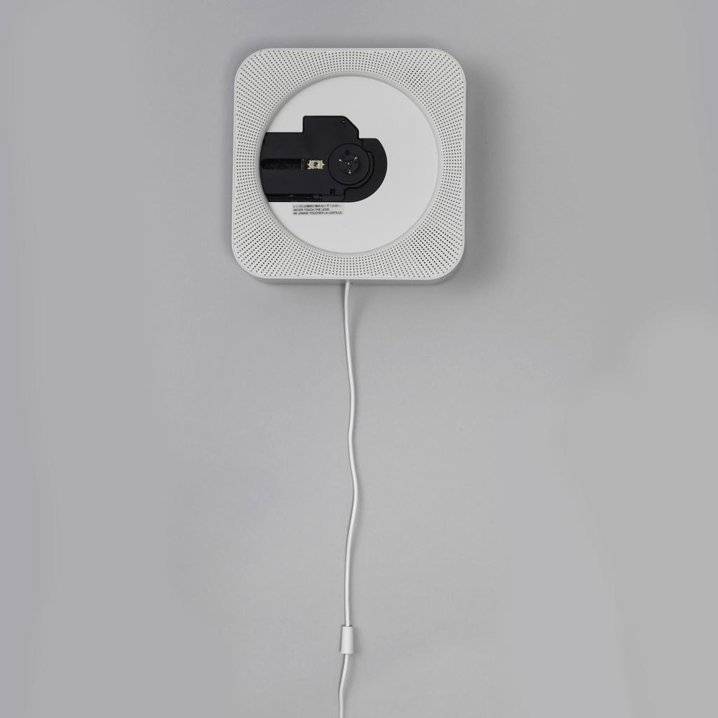 MUJI wall-mounted CD player with an exposed mechanism and a pull-cord switch