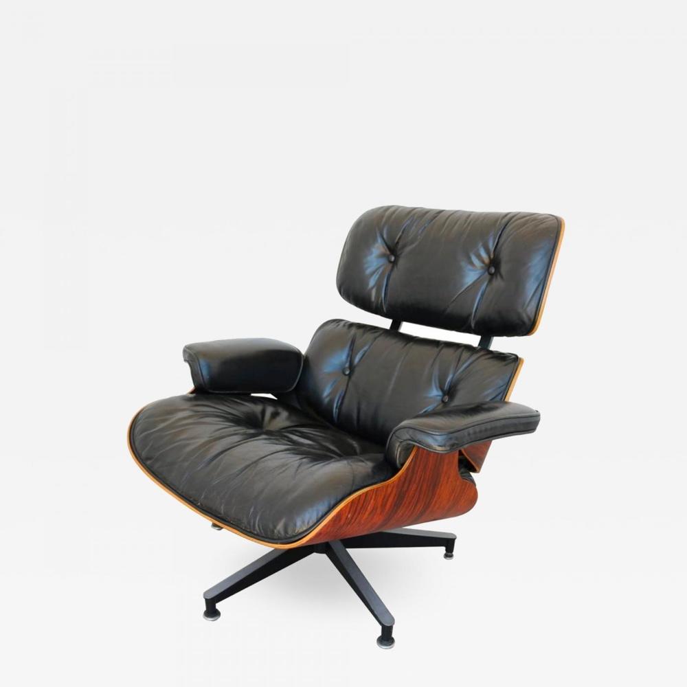 The Eameses' Lounge Chair in black leather and bent rosewood plywood on a metal star base