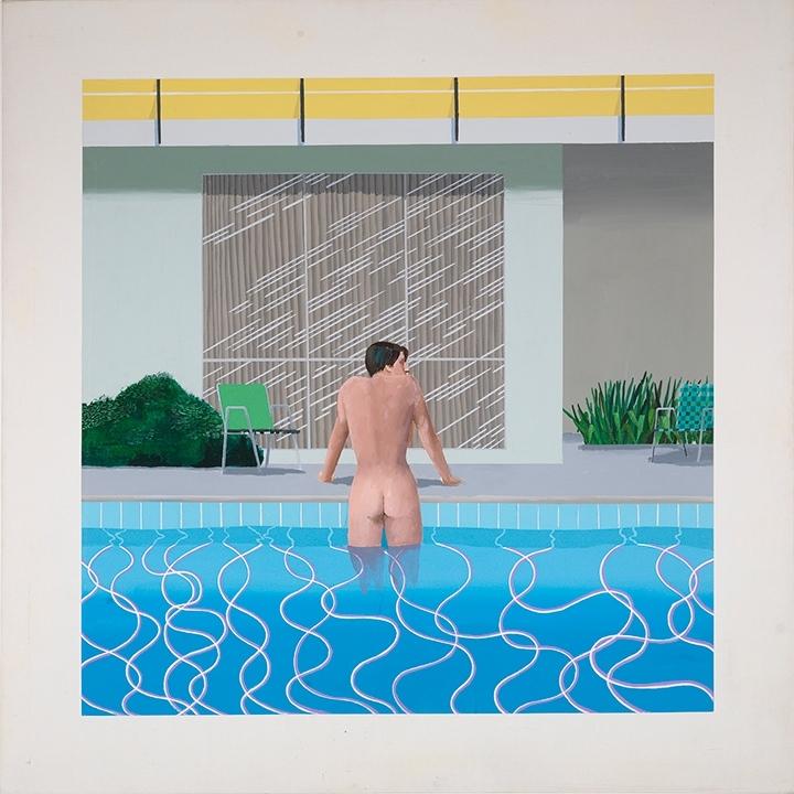 A nude man, seen from behind, stands waist-deep in a pool beside a glass-walled house