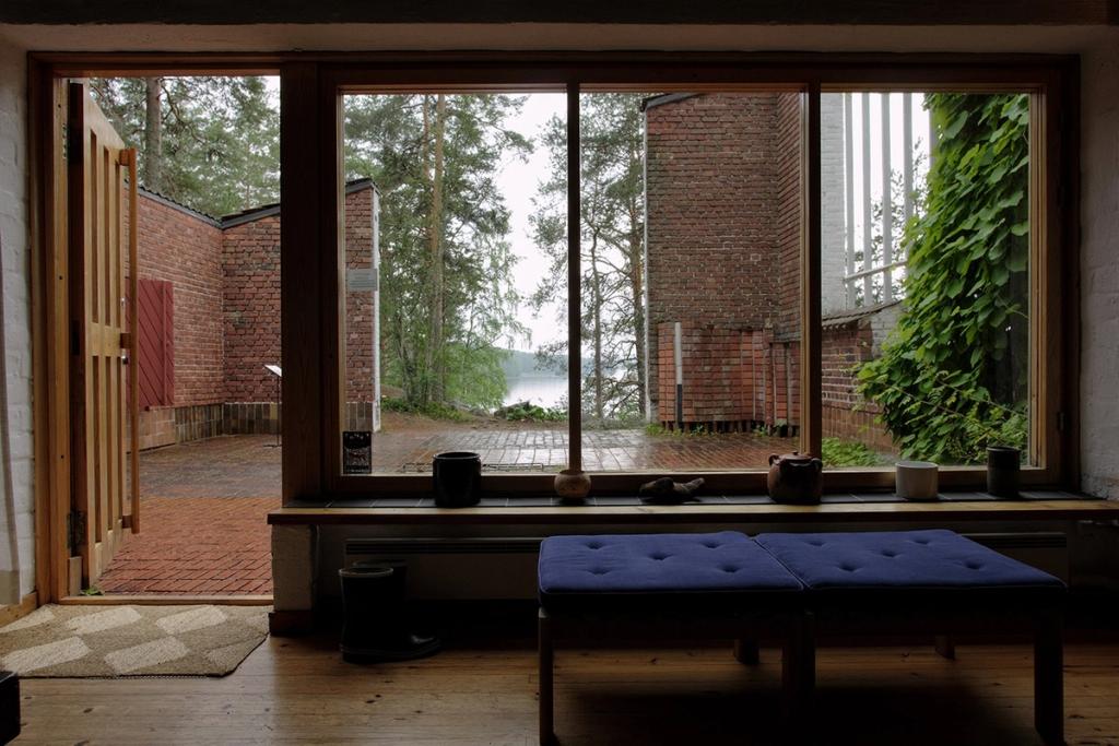 View from inside Aalto's house through a window onto the brick courtyard and the lake