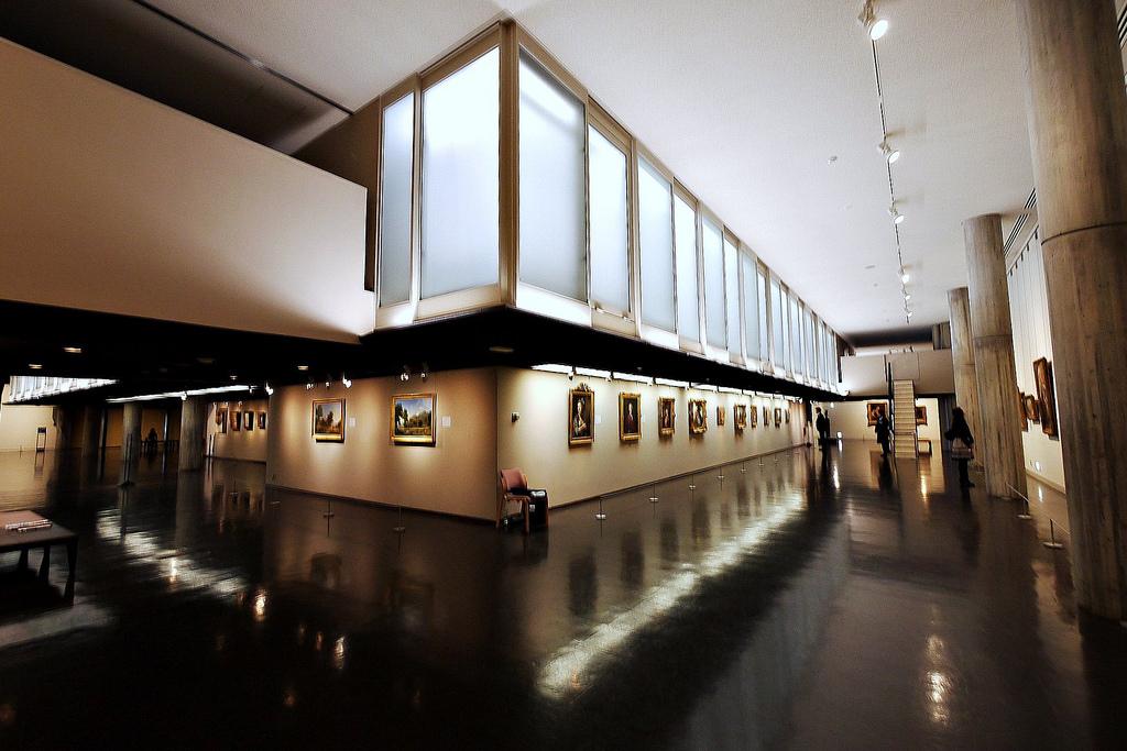 Interior of the National Museum of Western Art in Tokyo with top lighting and hanging paintings
