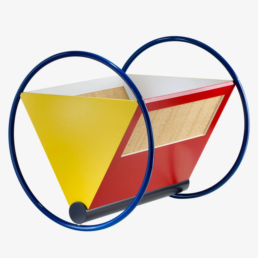 Bauhaus-style cradle with a yellow triangle, red body and blue circular rockers