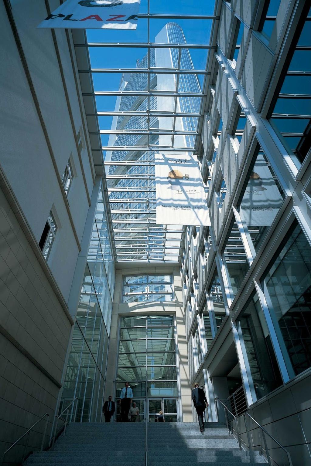 Looking up at the Commerzbank Tower from the glass atrium with its steps