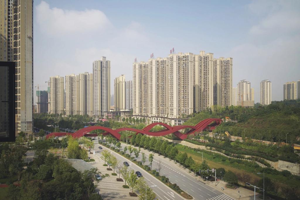 The red Lucky Knot Bridge among the high-rise buildings of Changsha, a general view of the knotted structure