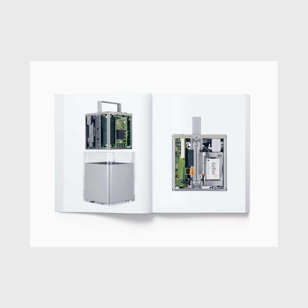 A spread featuring the transparent Power Mac G4 Cube and an AirPort card