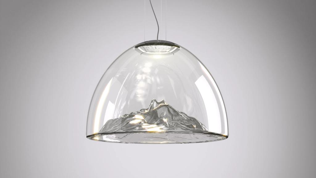 A glass dome pendant light with a mountain relief inside, designed by Dima Loginov