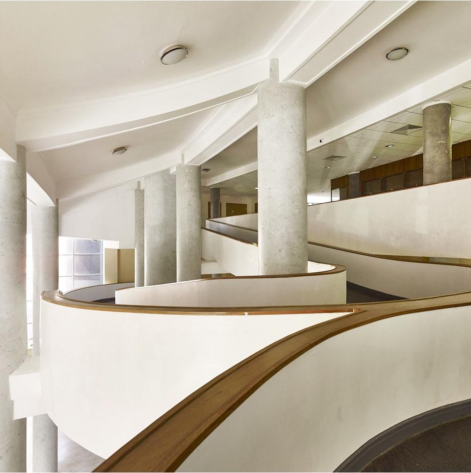 Interior of the Tsentrosoyuz, concrete columns and the spiral ramp of the lobby