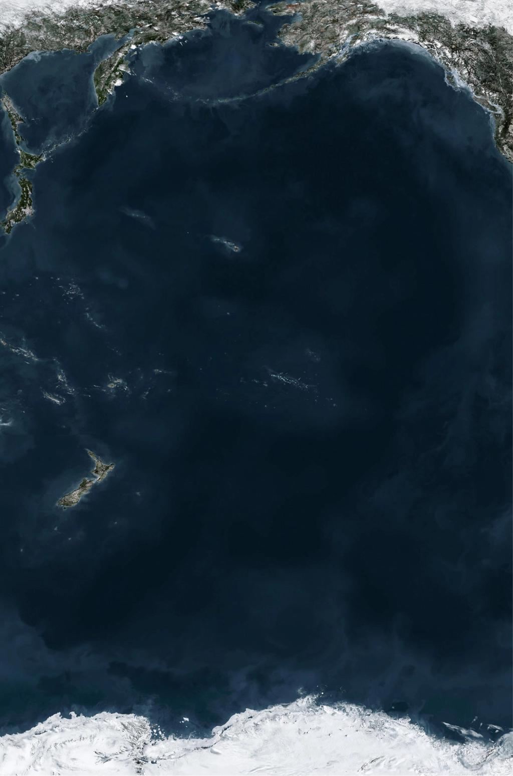 Satellite image of the Pacific Ocean: dark blue water between coastlines and the white ice of Antarctica