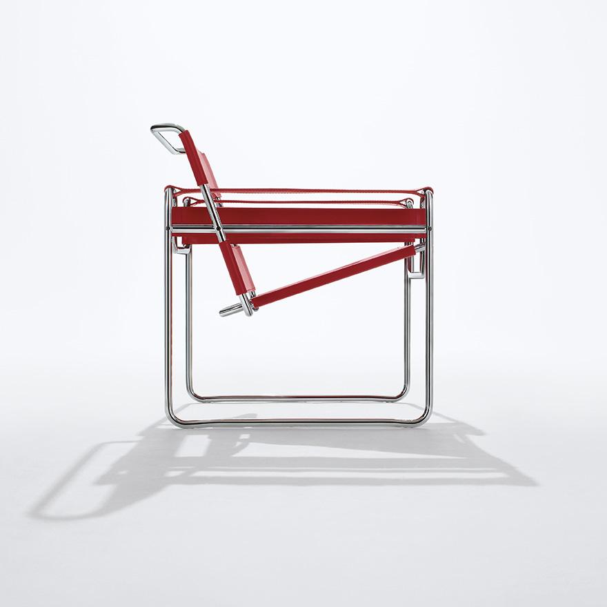 The Wassily Chair with red leather upholstery, side view showing the tubular frame