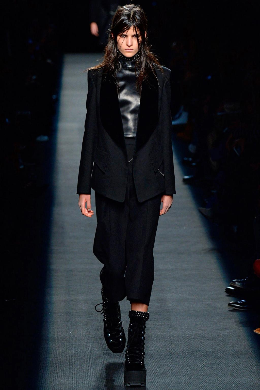 A black suit with a leather top and lace-up boots at an Alexander Wang show